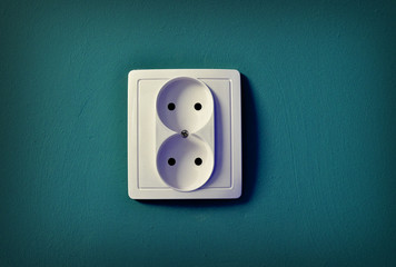 Alone outlet on wall background