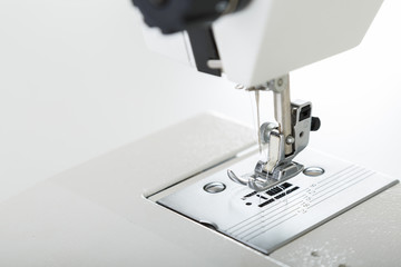 Close look of sewing machine needle