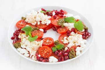 salad with cottage cheese, tomatoes, mint pesto and pomegranate
