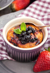 Portion of cottage cheese casserole and cup of coffee