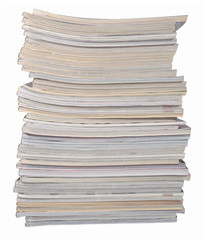 Stack of old magazines on a white