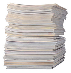 Stack of old magazines on a white
