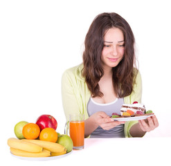 girl on a diet holding cake in hand