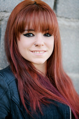 Rebellious teenager girl with red hair