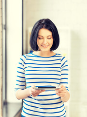 happy teenage girl with tablet pc computer