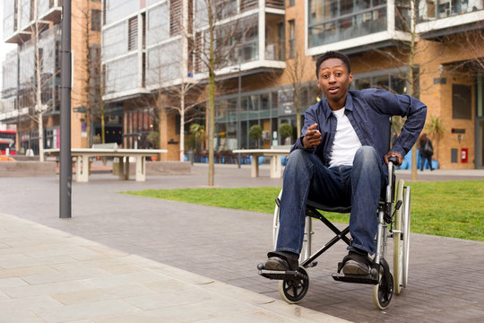 a young wheelchair user looking surprised.