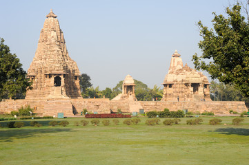 People climb to the hindu temple of Khaiuraho on India