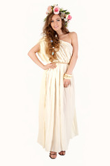 Beautiful women supermodel in wreath of flowers portrait.