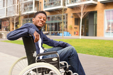 a happy young man in a wheelchair.