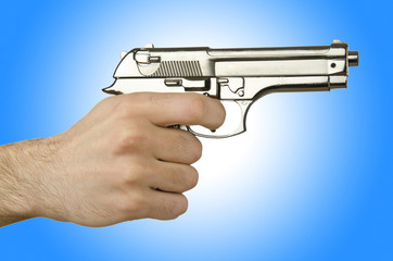 Gun in the hand on white