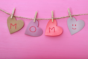 Mothers day message on paper hearts