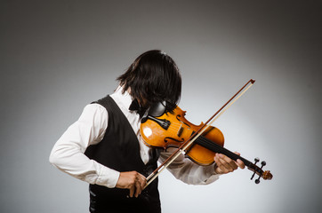 Fototapeta premium Musician plays cello isolated on white