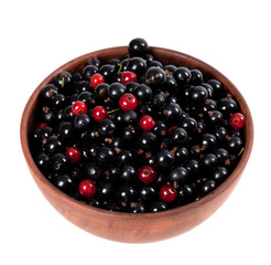 Blackcurrants and redcurrants in ceramic bowl