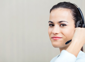Female Call Center Employee Using Headset