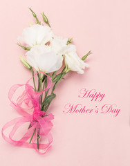 mother's day greeting with white flowers on pink
