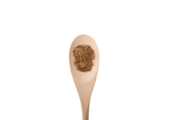Chinese five spice on a wood spoon isolated on white