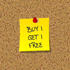 Yellor stick note paper with words BUY 1 GET 1 FREE pinned on co