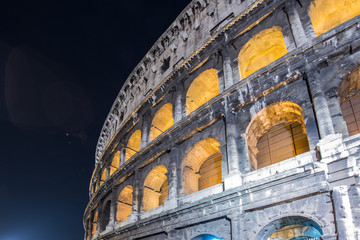 Naklejka na ściany i meble Famous colosseum during evening hours