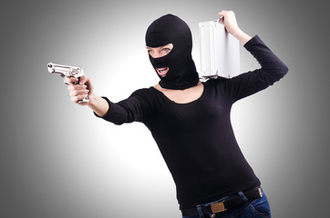 Criminal with gun isolated on white