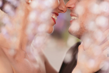 close up of groom and bride kissing
