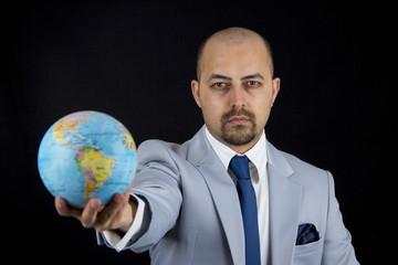 man holding world in his hand, save the planet