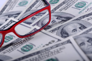 dollars banknotes and glasses