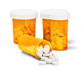 Medicine. Prescription Medication Spilling From an Open Medicine
