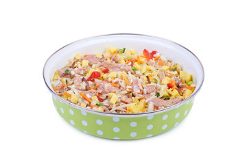 Raw meat with vegetables in a pan isolated on white background