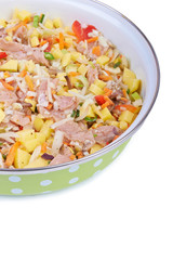 Raw meat with vegetables in a pan isolated on white background