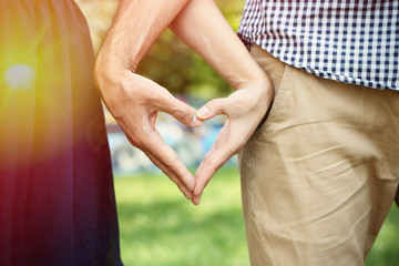 Loving couple holding hands outdoors