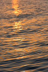 Blur background of the water surface at sunset