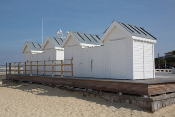 Fototapeta na wymiar White wooden cabin on the beach