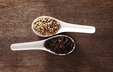Black and white  peppercorns