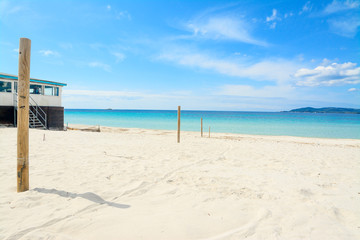 wooden poles by the shore