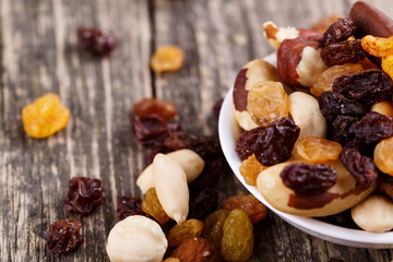 Fototapeta premium Mixed nuts on a white plate.