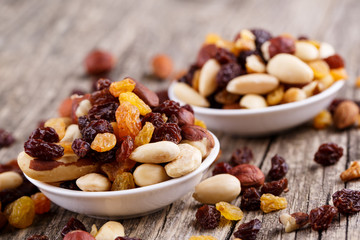 Mixed nuts on a white plate.