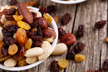 Mixed nuts on a white plate.