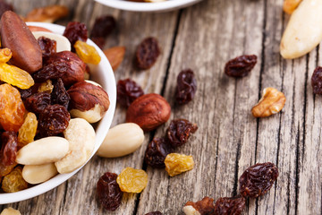 Mixed nuts on a white plate.
