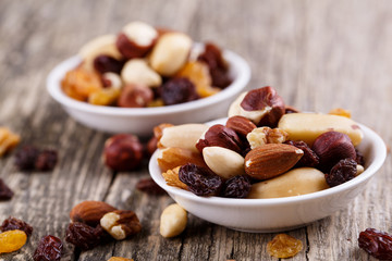Mixed nuts on a white plate.