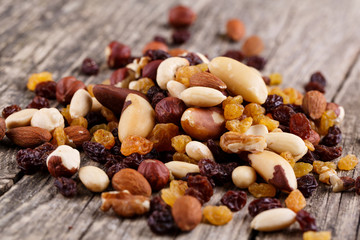 Mixed nuts on a white plate.