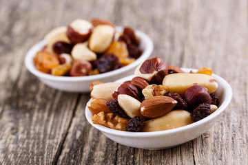 Fototapeta premium Mixed nuts on a white plate.