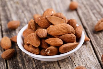 Almonds on a white plate.