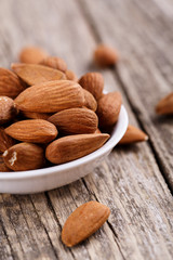 Almonds on a white plate.