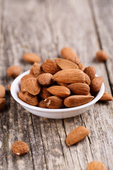 Almonds on a white plate.