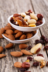 Mixed nuts on a white plate.