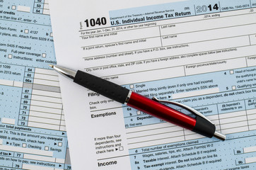 U.S. individual income tax return form 1040 with pen