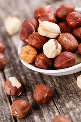 Hazelnuts on a white plate.