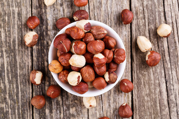 Hazelnuts on a white plate.