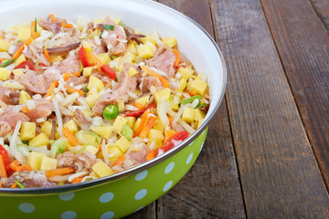 Raw meat with vegetables in a pan, stew