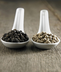 Black and white  peppercorns